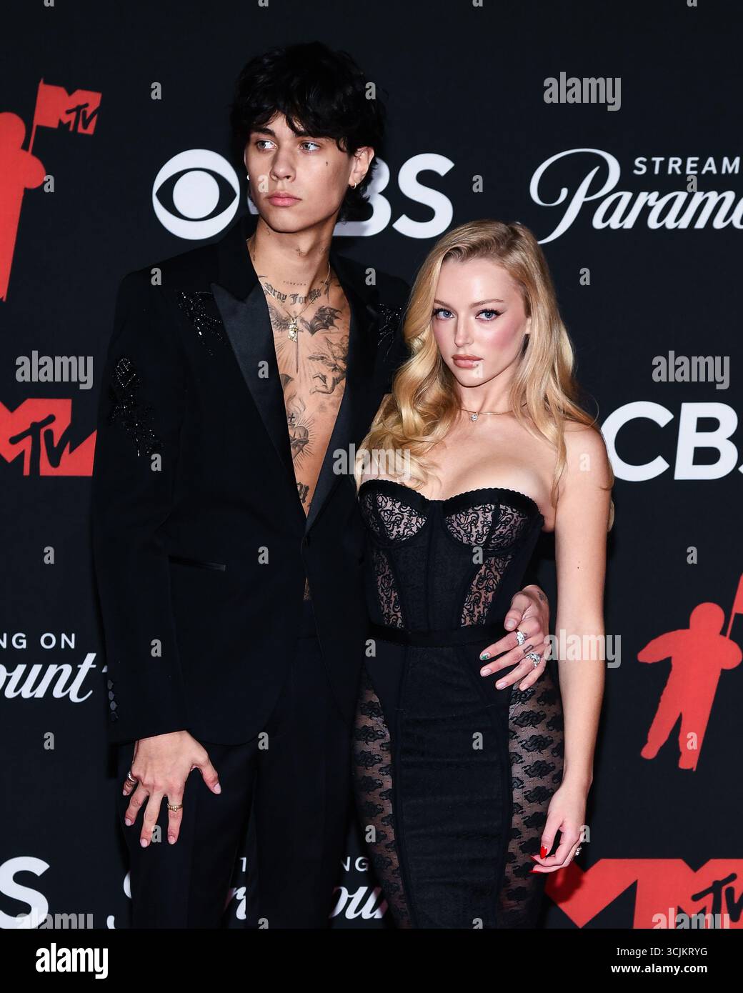 Landon Barker and Skyla Sanders walking on the red carpet at the 2025