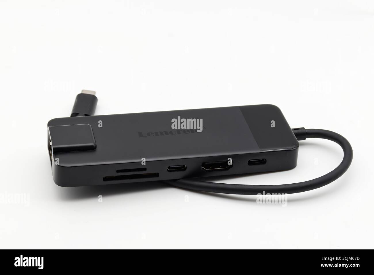 A sleek black Lemorele USB-C hub with multiple ports including HDMI isolated on white background. Stock Photo