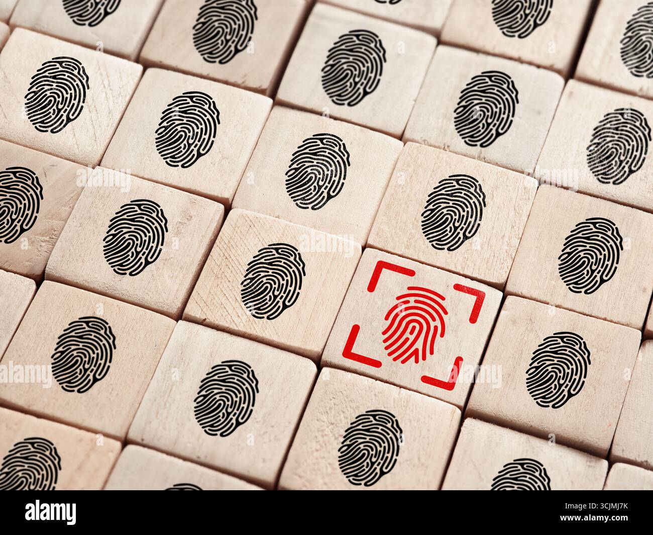 Biometric fingerprint scanner verifying identity on wooden blocks representing personal data protection Stock Photo