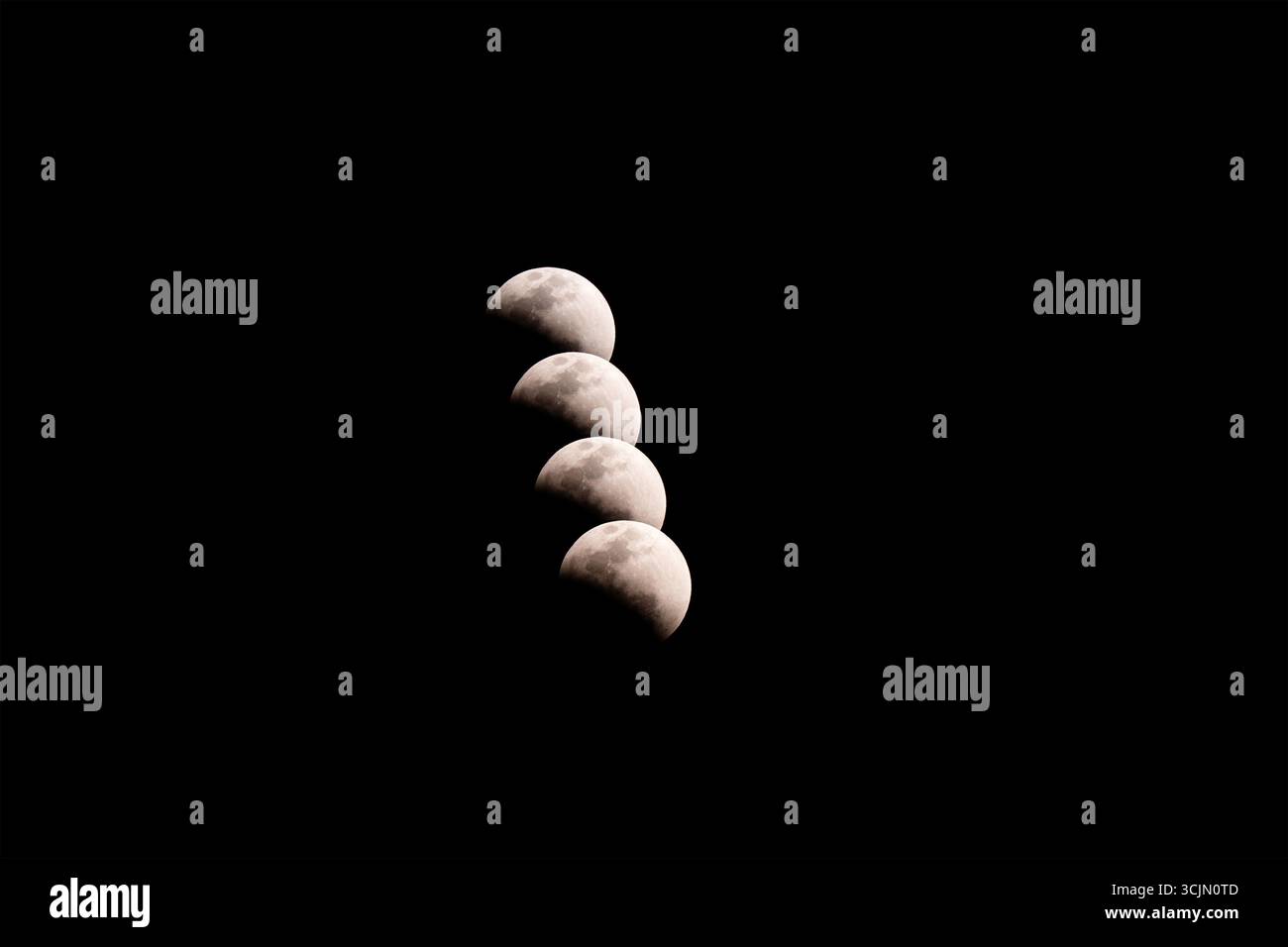 Lunar eclipse composite sequence over night sky, Tete, Mozambique Stock Photo