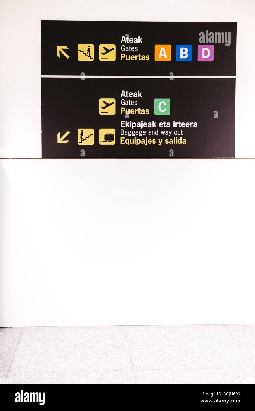 Information panel with gate directions and exit signage at airport ...