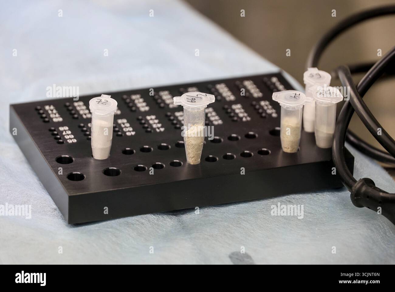 Micro test tubes contain powder from the repatriated remains of perished Ukrainian military personnel that will be used by the experts of the Odesa Regional Bureau of Forensic Medical Examination for DNA profiling, Odesa region, Ukraine, September 4, 2025. (Photo by Nina Liashonok/Ukrinform) Stock Photo