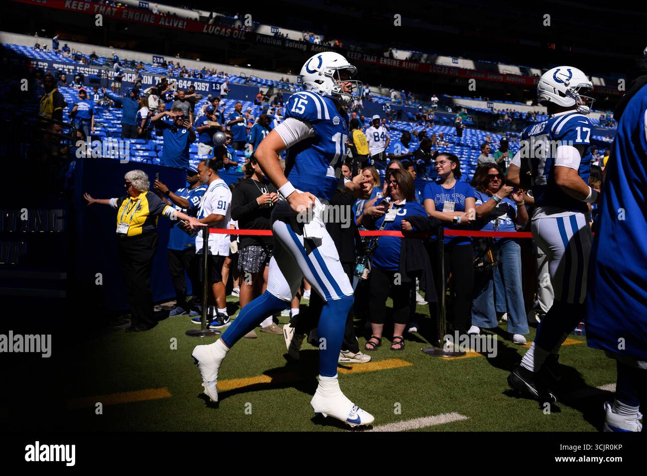 Indianapolis Colts quarterback Riley Leonard (15) runs onto the field ...