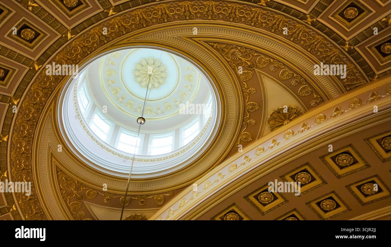 Ornate dome ceiling of the National Statuary Hall in the United States Capitol, Washington D.C., with neoclassical gold detailing. Stock Photo