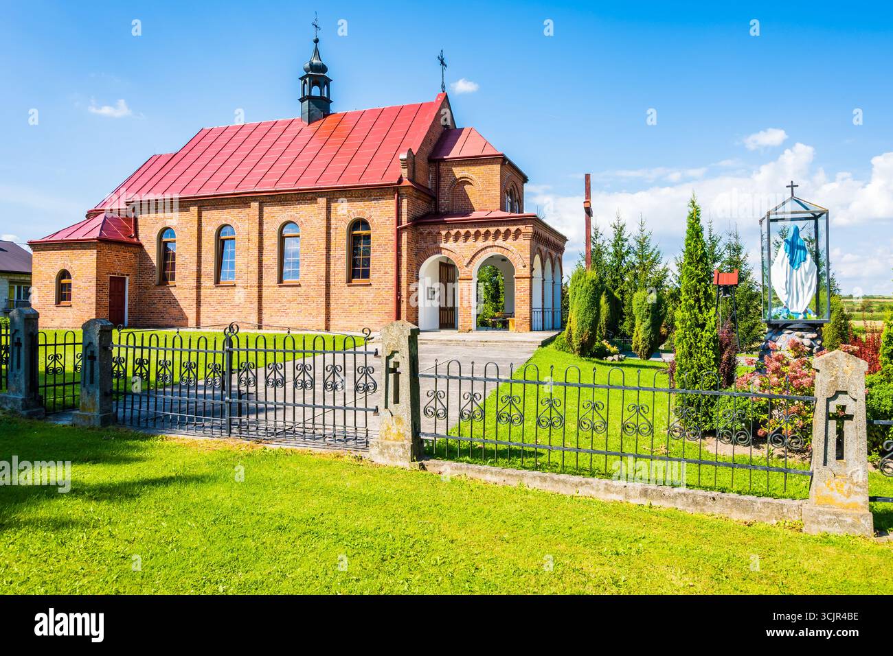 Church built from red bricks in small village of Chlopkow, Roztocze region, Poland Stock Photo