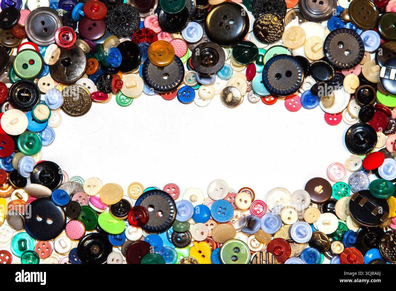Multi-colored buttons on a white background close-up. Stock Photo