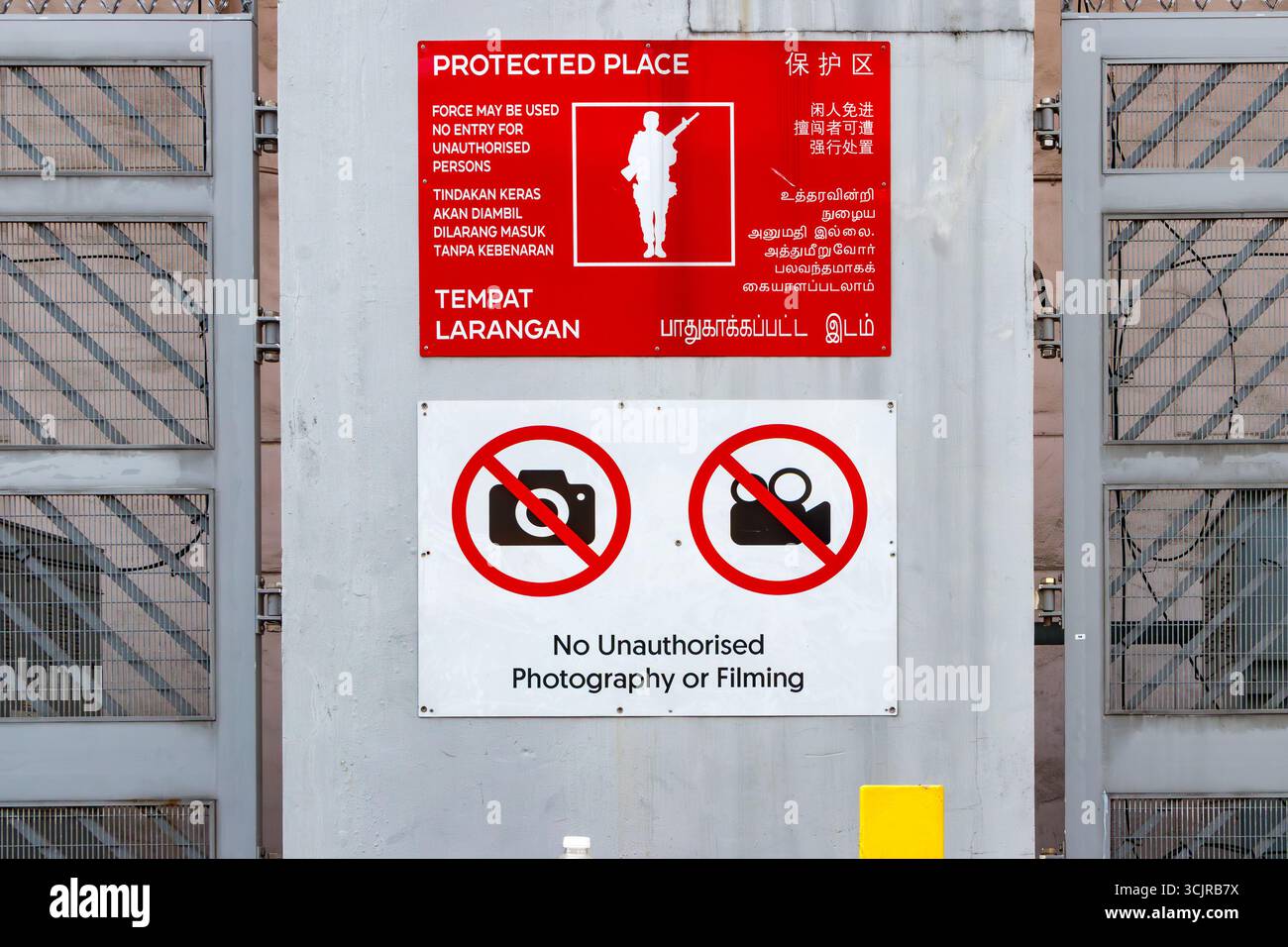 Security signs are displayed at a restricted area, warning against ...