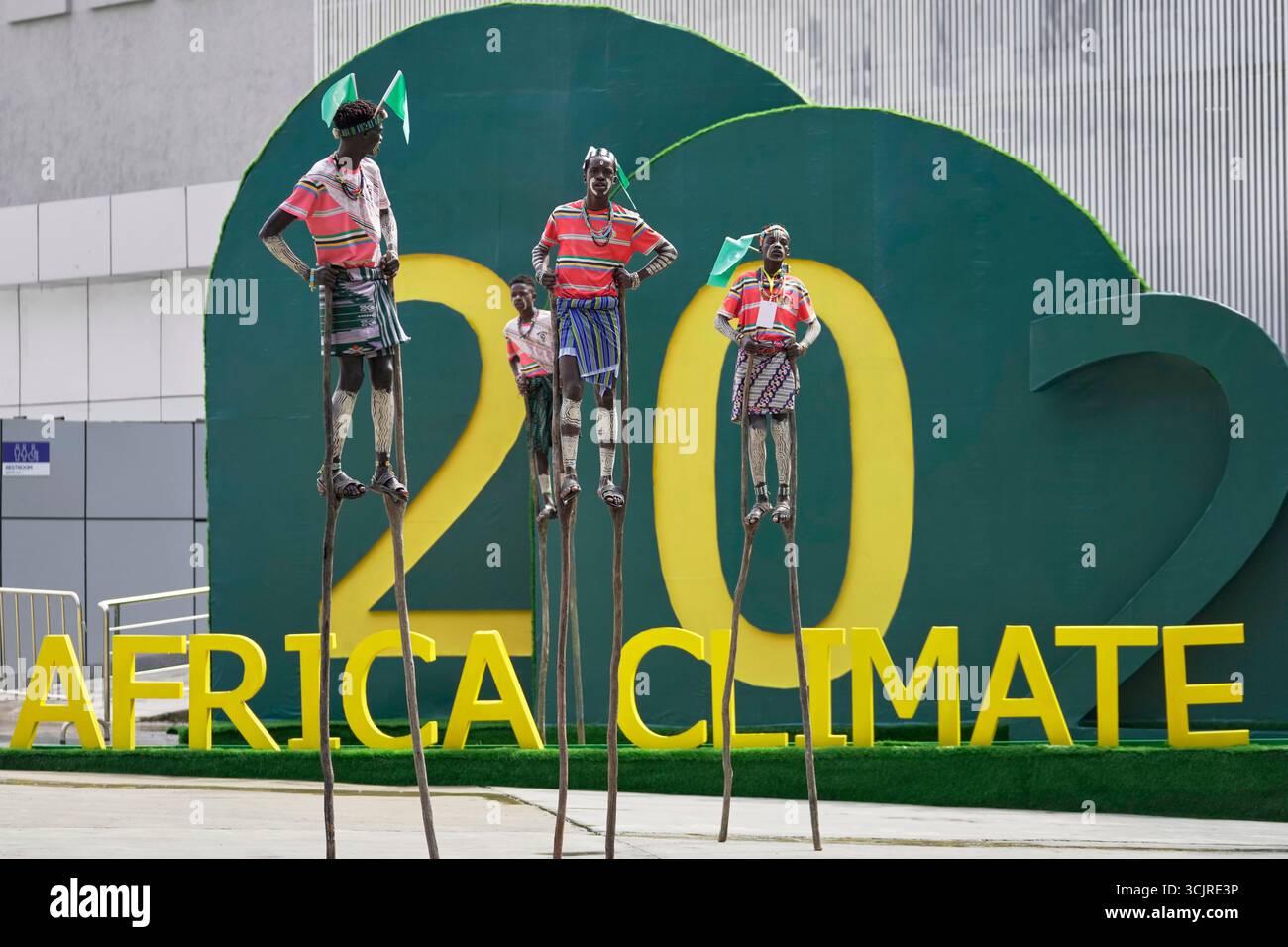Artists walk on stilts during the Second Africa Climate Summit (ACS2 ...