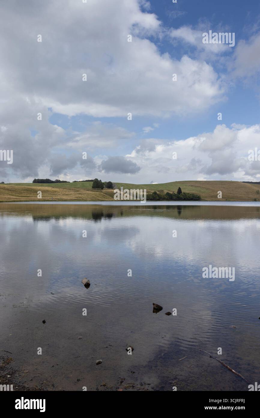 Beautiful summer view of Lac Chauvet near Super Besse, in Picherande, Auvergne, France. Copy space above and below. - Stock Image