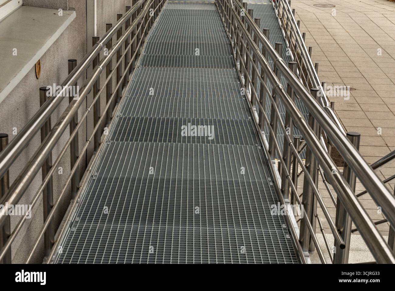 Accessible ramp for disabled people, metal ramp with handrails for ...
