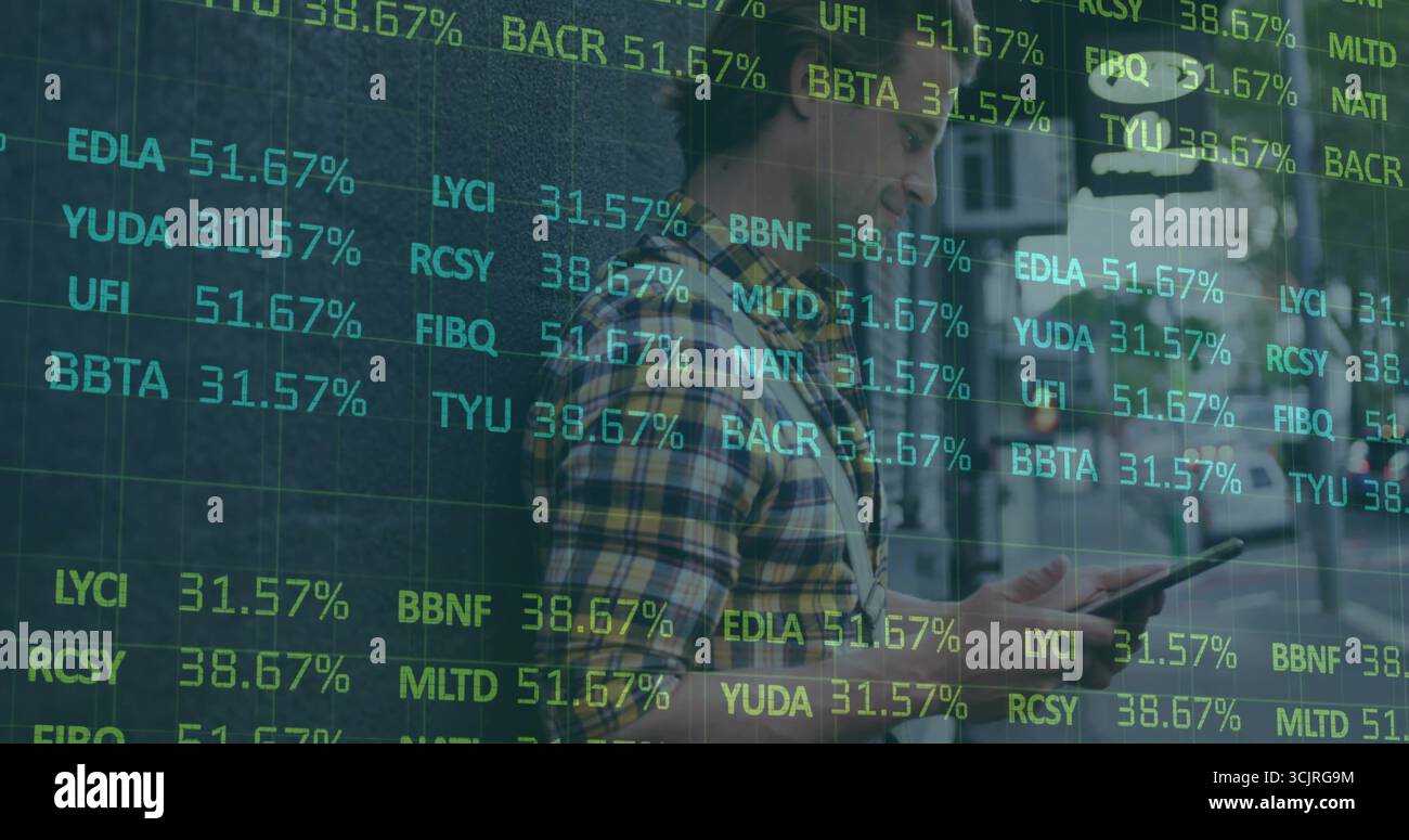 Man checking tablet by stone facade on city sidewalk, with financial tickers floating Stock Photo