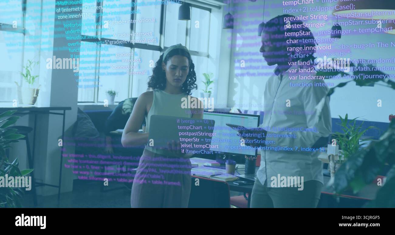 Collaborating colleagues coding on laptop and tablet in modern office, with floating code lines Stock Photo