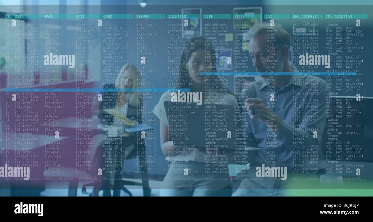 Studying code on digital screen at office, IT professionals wearing gray sweater with coffee mug Stock Photo