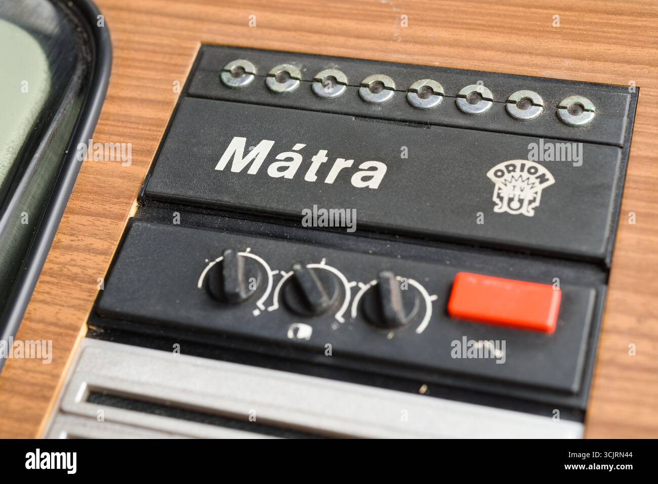 Bulanka, Czech Republic, 2 September 2025 - close-up of Orion Mátra vintage television with logo, rotary knobs, red button and wood grain design, retr Stock Photo