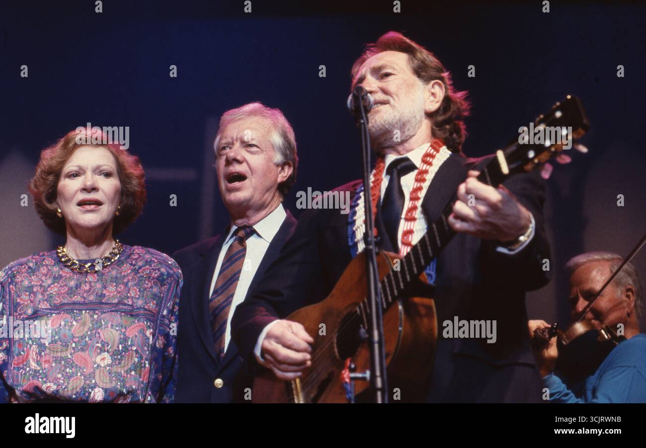 Former U.S. President JIMMY CARTER and wife ROSALYNN CARTER sing before executives along with legendary musician WILLIE NELSON at a Habitat for Humanity fund-raiser in Austin on August 2, 1989. Stock Photo