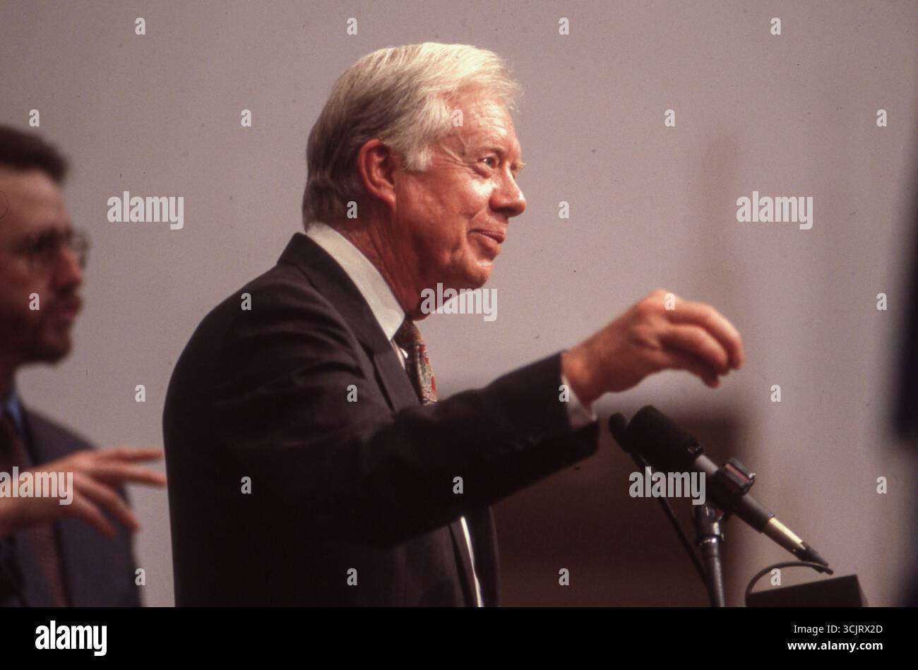 Former U.S. President JIMMY CARTER makes a speech before executives along with legendary musician WILLIE NELSON (not shown)  at a Habitat for Humanity fund-raiser in Austin on August 2, 1989. Stock Photo