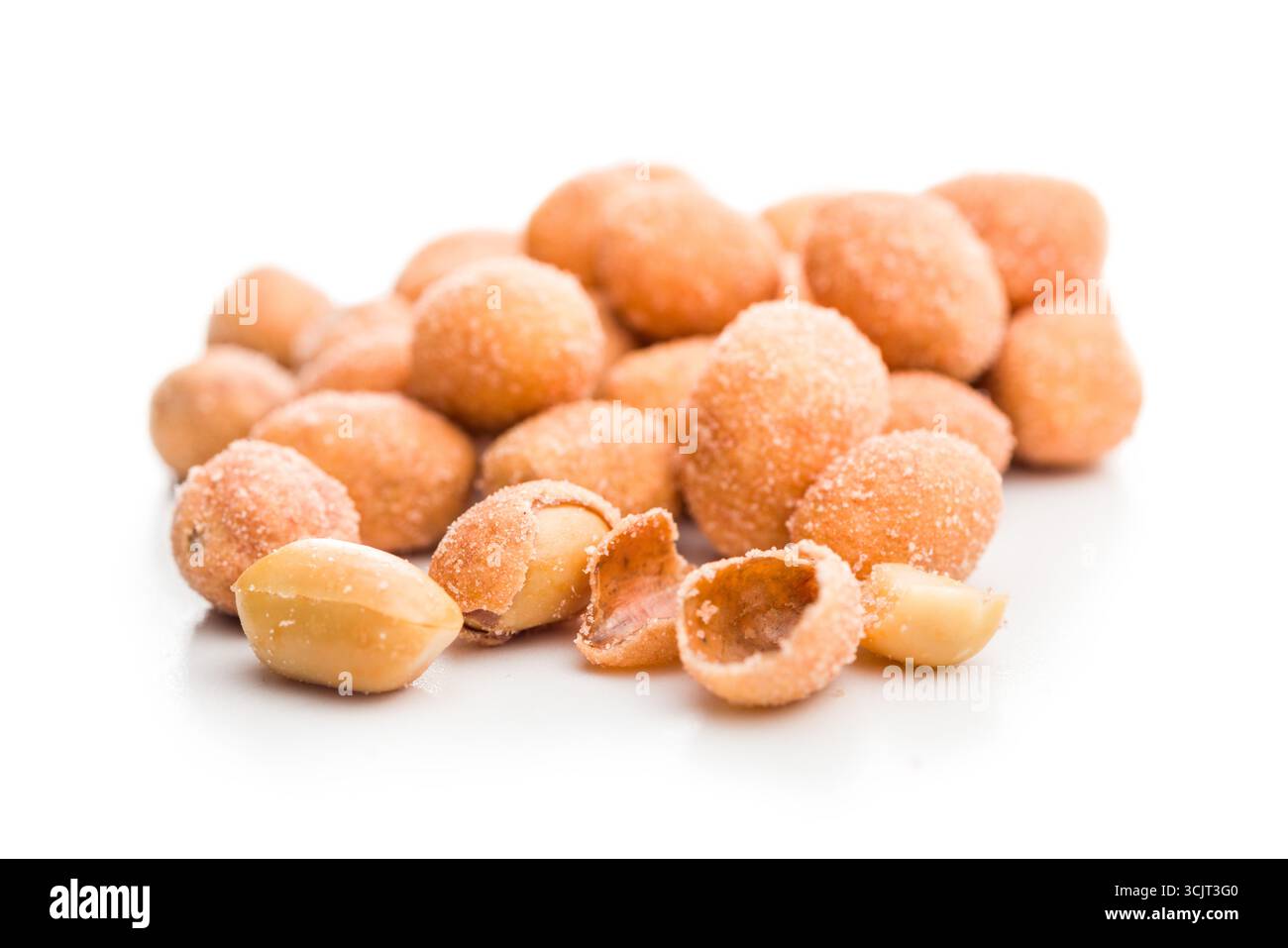 Peanuts in a crispy crust isolated on a white background. Stock Photo