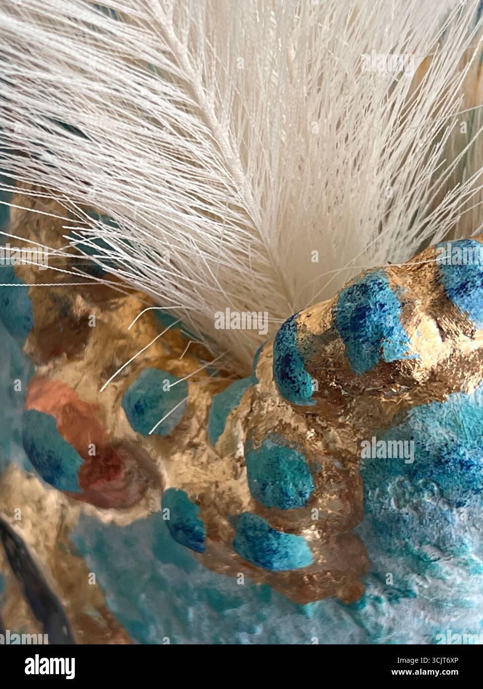 voluminous texture of a papier-mâché vase, blue color, abstract background, with gold potal, detail of a vase for the background - Smartphone Captured Stock Image