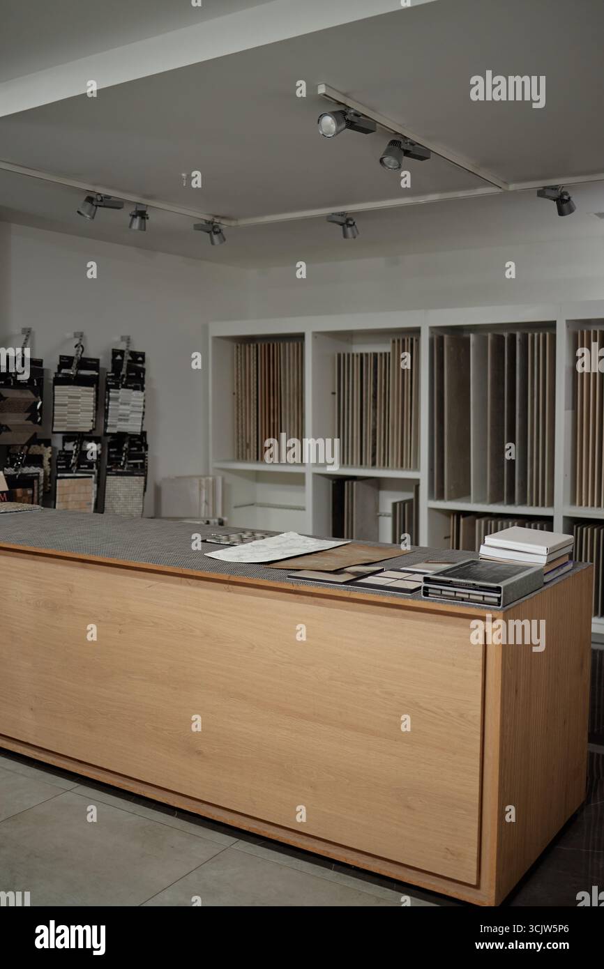 Modern Interior Design Studio Displaying Material Samples on Wooden Counter Stock Photo