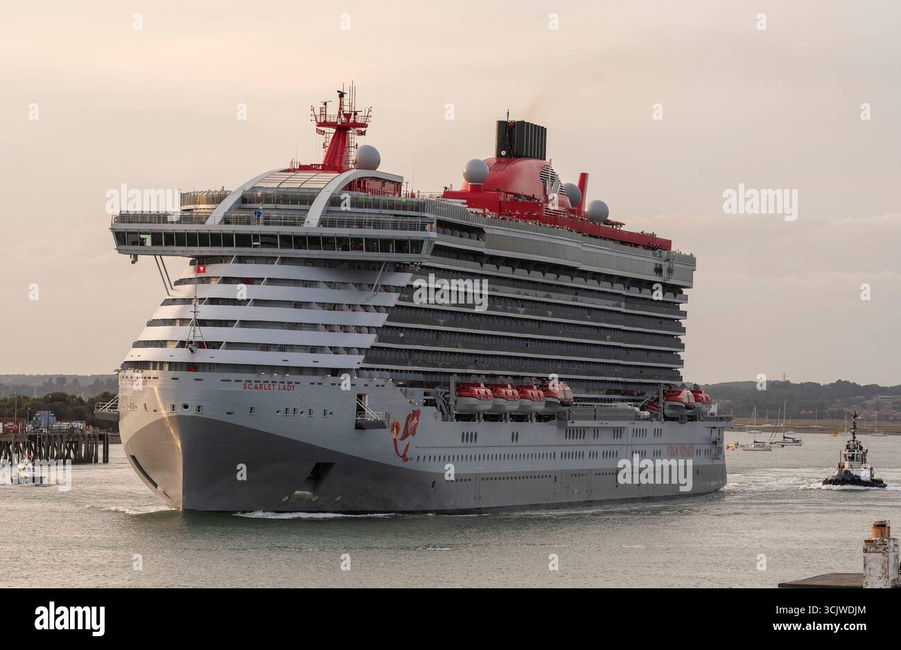 Portsmouth England UK.  The Scarlet Lady cruise ship outbound  on Portsmouth Harbour southerrn England UK. Stock Photo