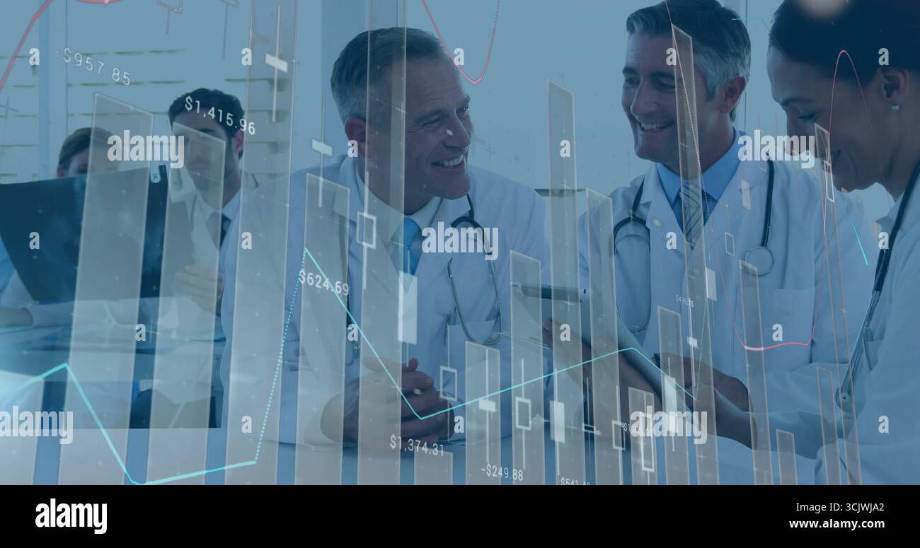 Reviewing medical team examining reports at clinic conference table ...