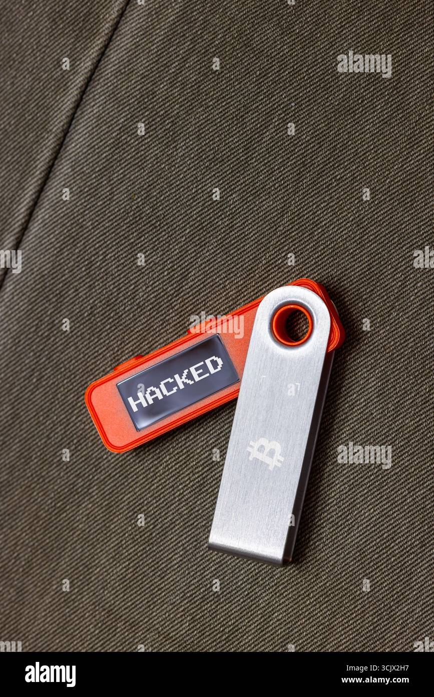 orange hardware Bitcoin cold wallet with stolen message on screen Stock  Photo - Alamy