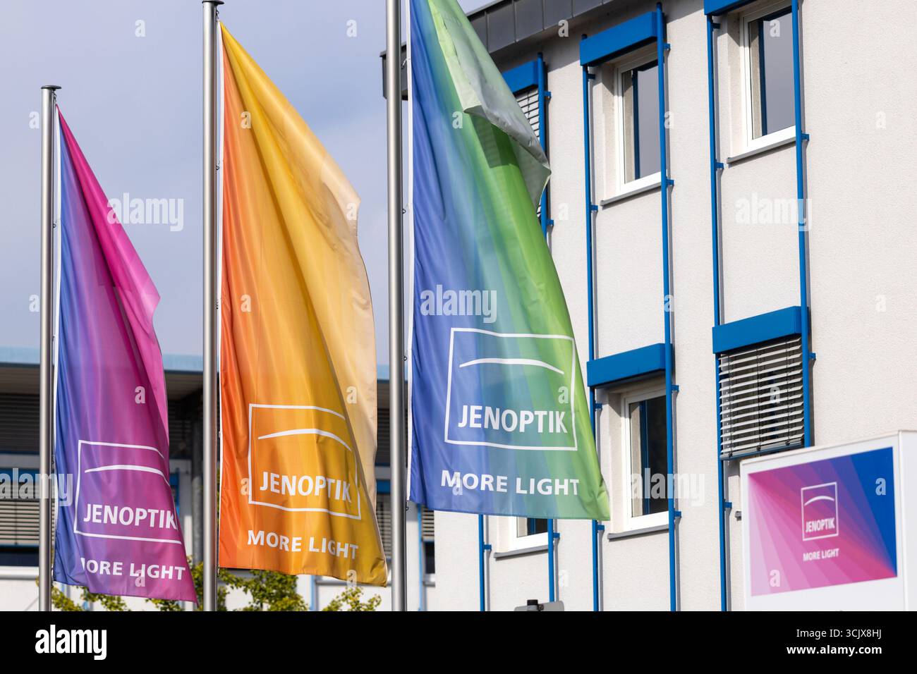09 September 2025, Thuringia, Jena/Göschwitz: Jenoptik flags fly in ...