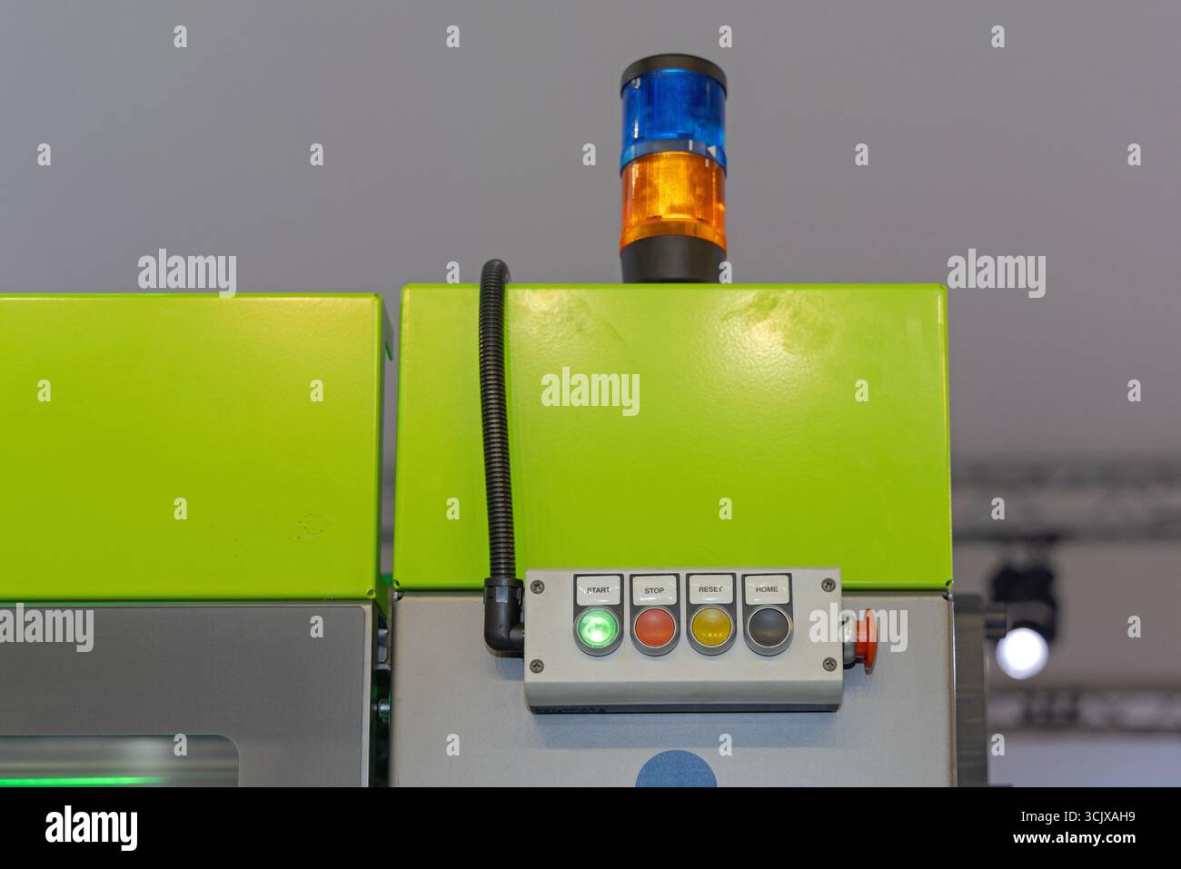 Machine Control Push Buttons Start Signal Light at Top Stock Photo