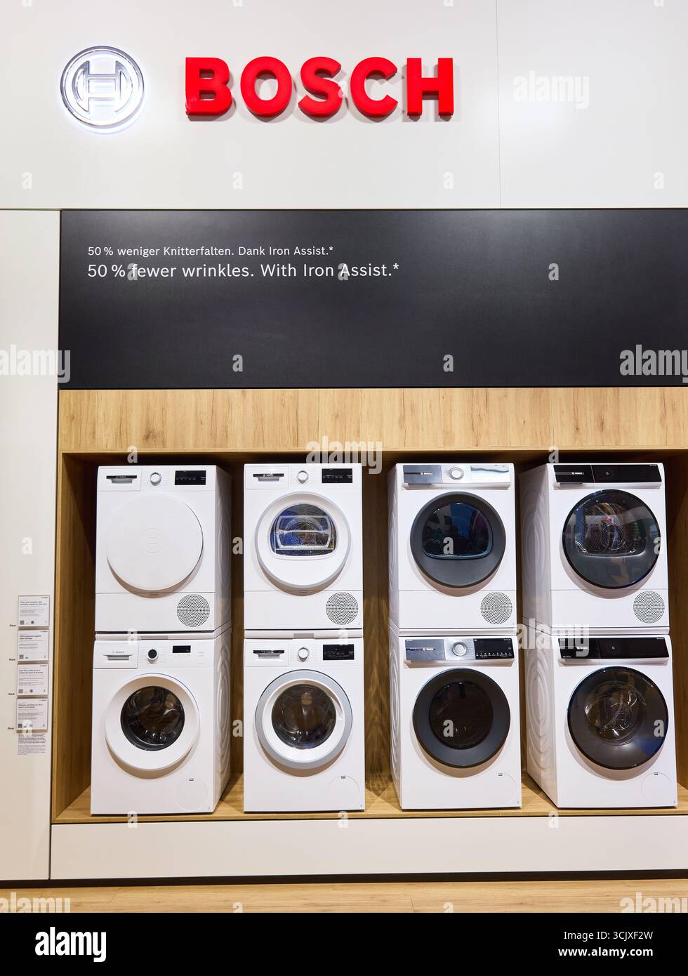 BERLIN, GERMANY - September 7th, 2025: Photo of Bosch brand logo and washing mashines at IFA consumer electronics trade fair Stock Photo
