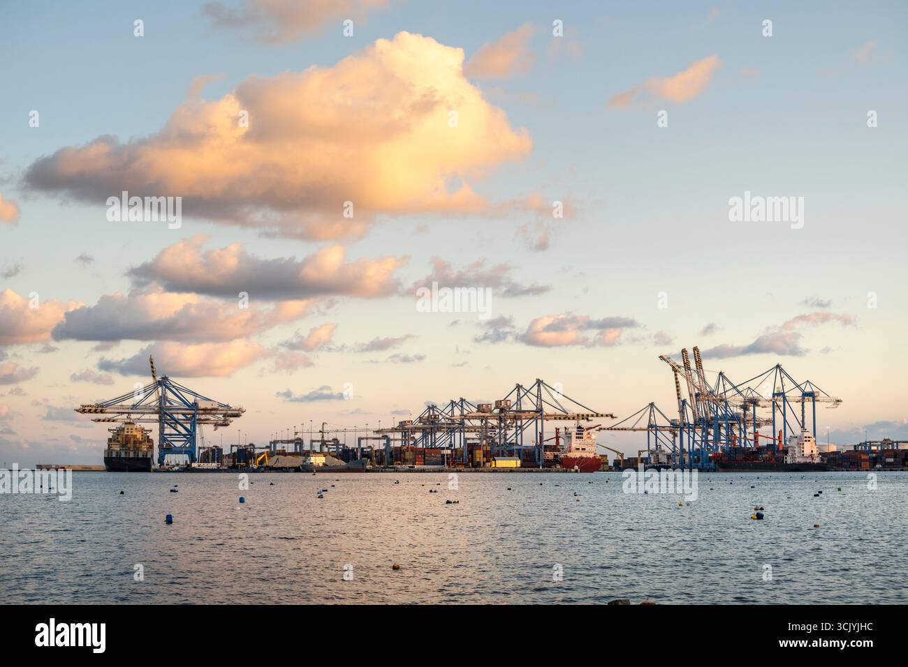 Amazing container terminal at sunset in Malta Freeport, Birzebbuga Stock Photo