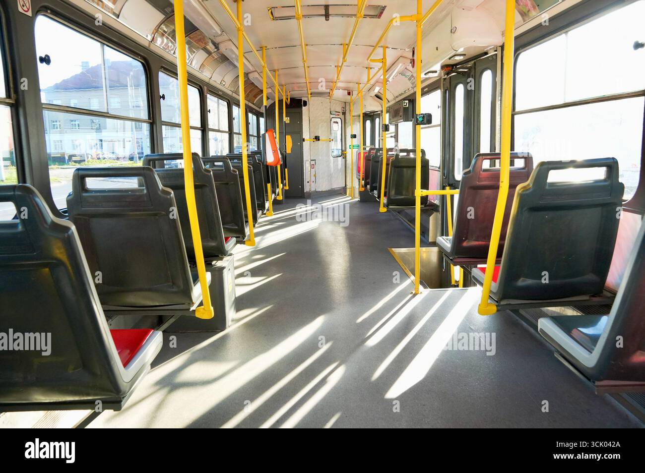 Interior of a public bus with empty seats and yellow seats Stock Photo ...