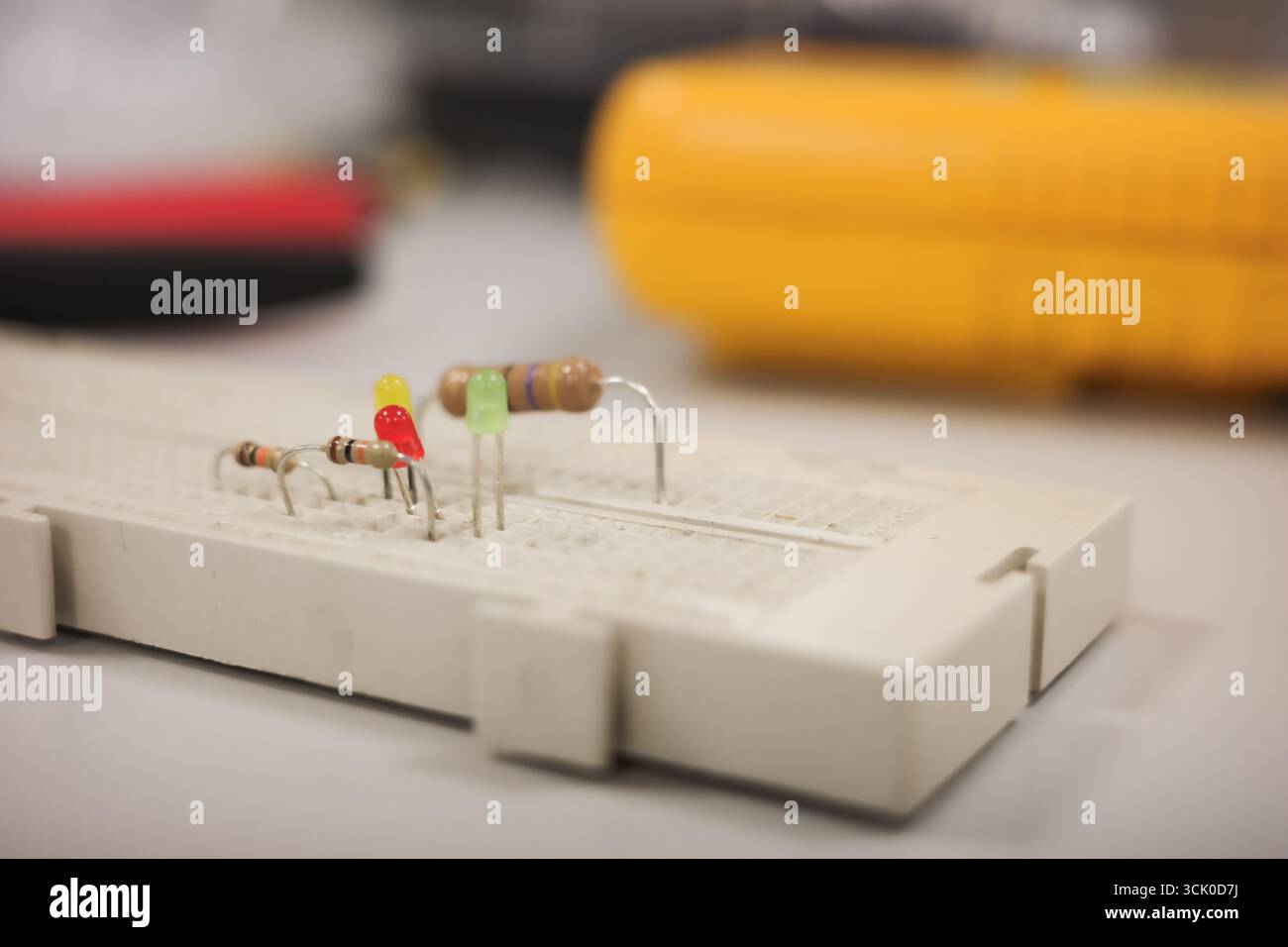 Electronic breadboard with resistors and LED components Stock Photo