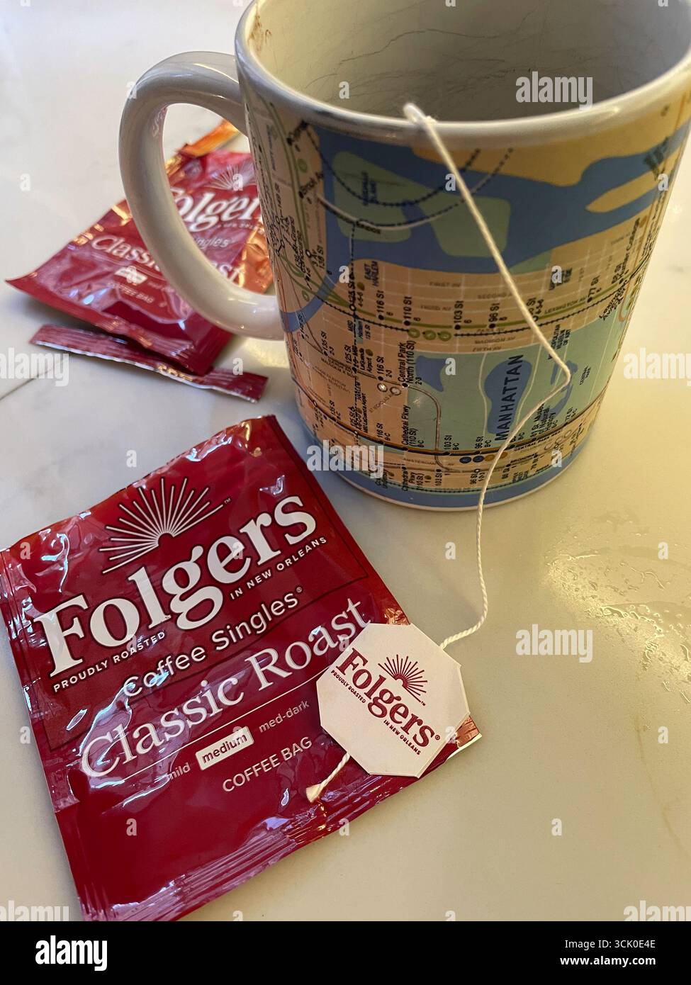 Still life of Folgers classic roast single coffee bag awaits boiling water on a kitchen counter, 2025, United States - Smartphone Captured Stock Image
