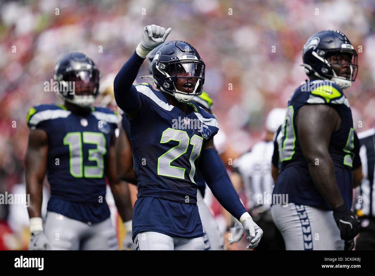 Seattle Seahawks cornerback Devon Witherspoon (21) looks on during an ...