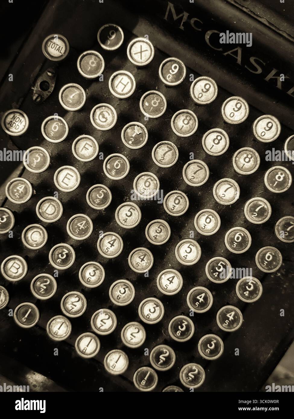 Vintage McCaskey adding machine in black and white - Smartphone Captured Stock Image