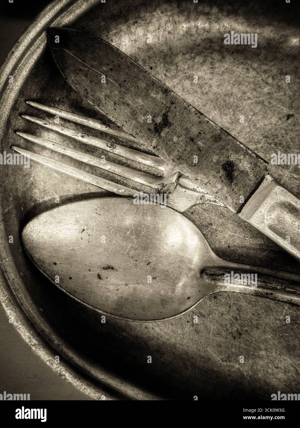 Vintage military mess kit in sepia tone - Smartphone Captured Stock Image