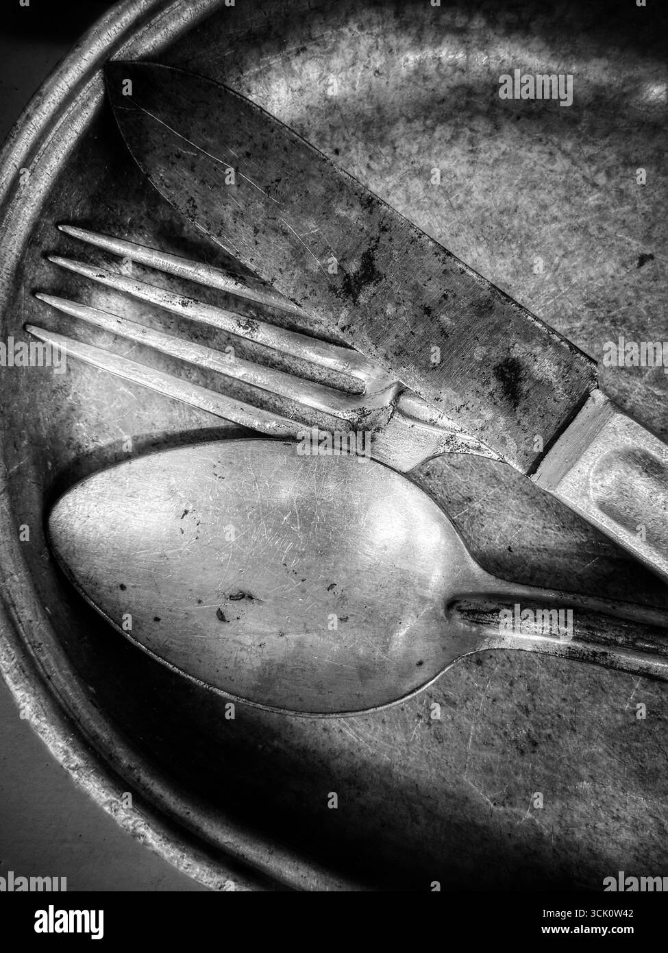Vintage military mess kit in black and white - Smartphone Captured Stock Image