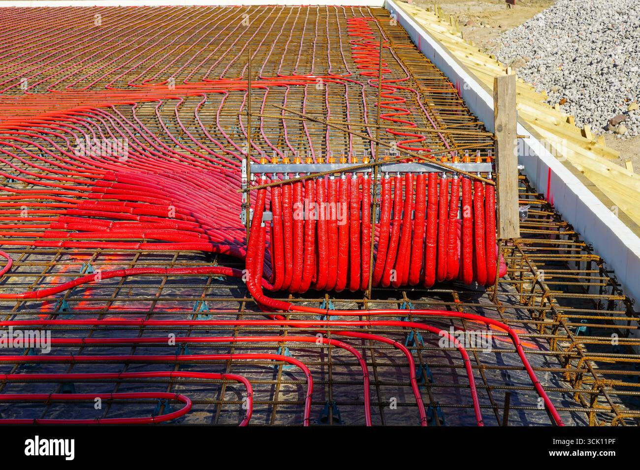 Image showcasing Red underfloor heating pipes installed in reinforced insulated ...