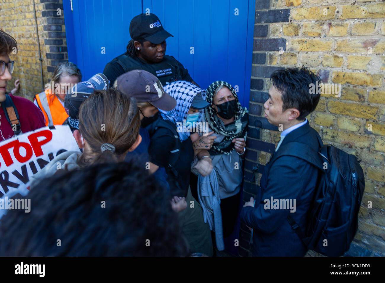 Hundreds of activists gathered outside the ExCeL Centre in London to ...