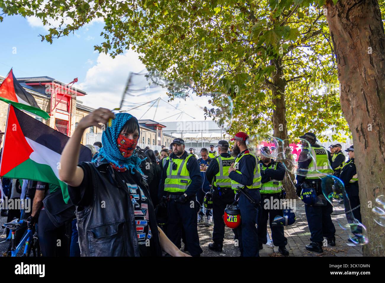 Hundreds of activists gathered outside the ExCeL Centre in London to ...