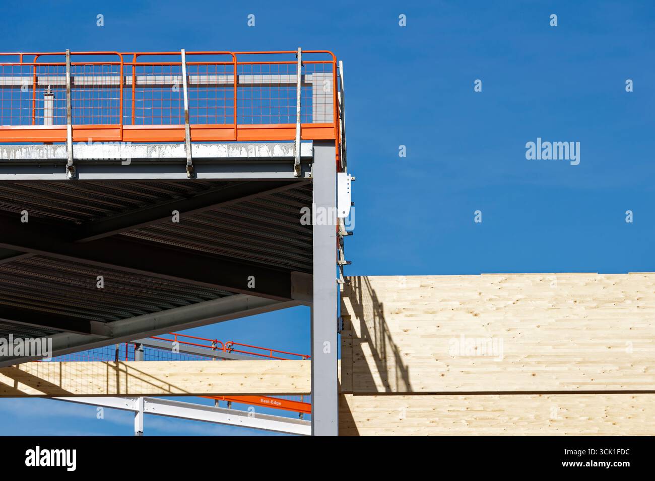 Glulam laminated timber frame attached to steel skeleton frame with ...