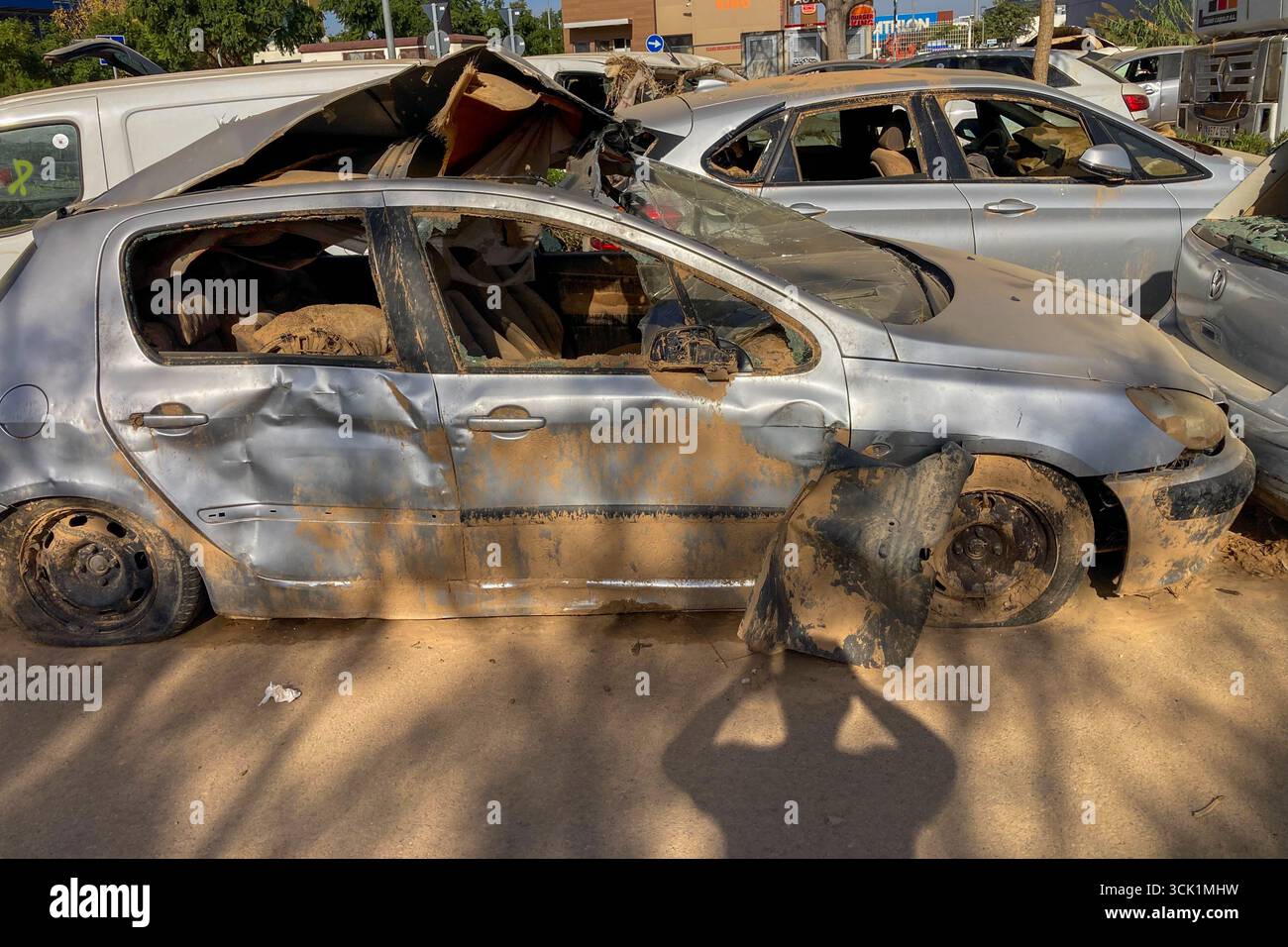 VALENCIA, SPAIN - NOVEMBER 18, 2024: Damaged cars and debris from flooding caused by floods from hurricane DANA in Valencia, Spain - Smartphone Captured Stock Image