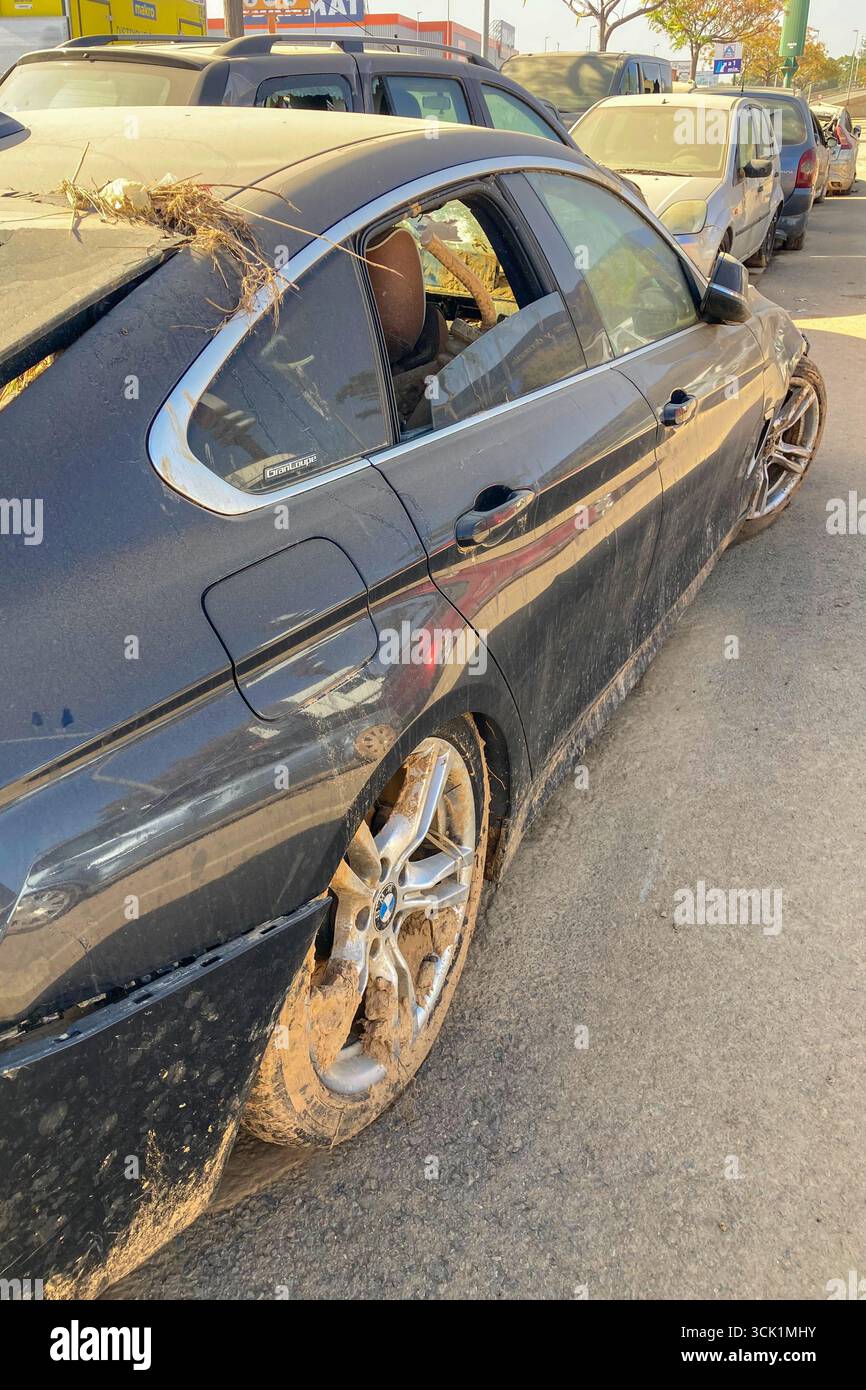 VALENCIA, SPAIN - NOVEMBER 18, 2024: Damaged cars and debris from flooding caused by floods from hurricane DANA in Valencia, Spain - Smartphone Captured Stock Image