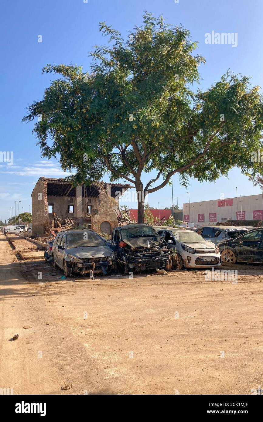 VALENCIA, SPAIN - NOVEMBER 18, 2024: Damaged cars and debris from flooding caused by floods from hurricane DANA in Valencia, Spain - Smartphone Captured Stock Image
