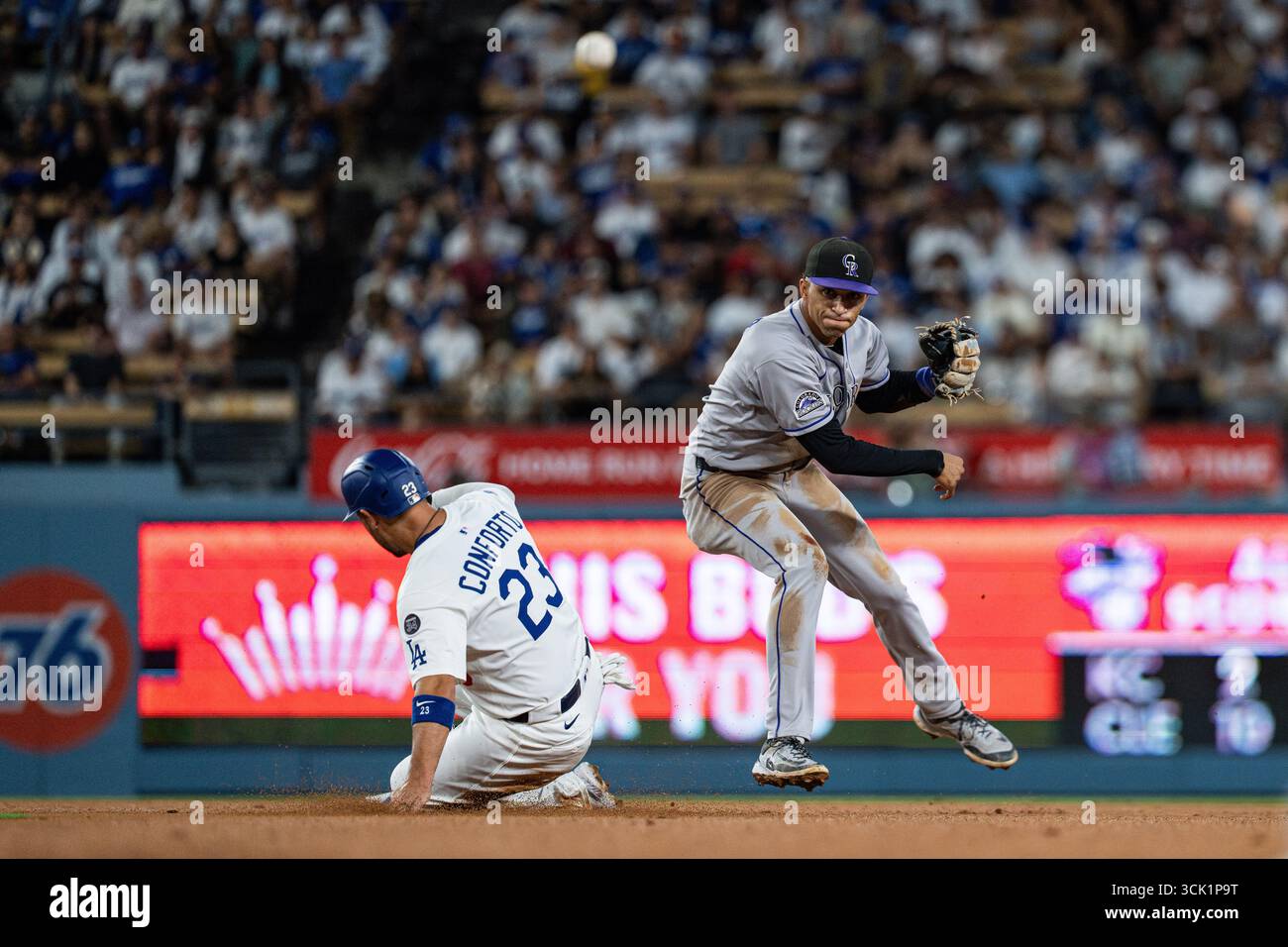 Colorado Rockies shortstop Ryan Ritter (8) turns a double play during a ...