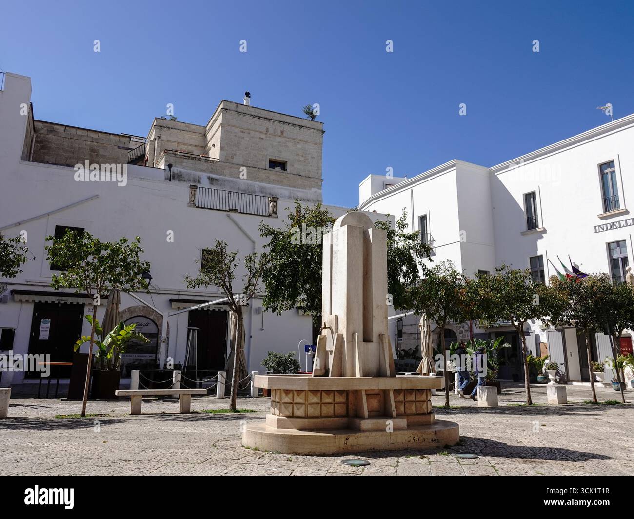 Fountain in the middle of Piazza Giuseppe Garibaldi, a historic square in old town, Monopoli, Italy. Stock Photo