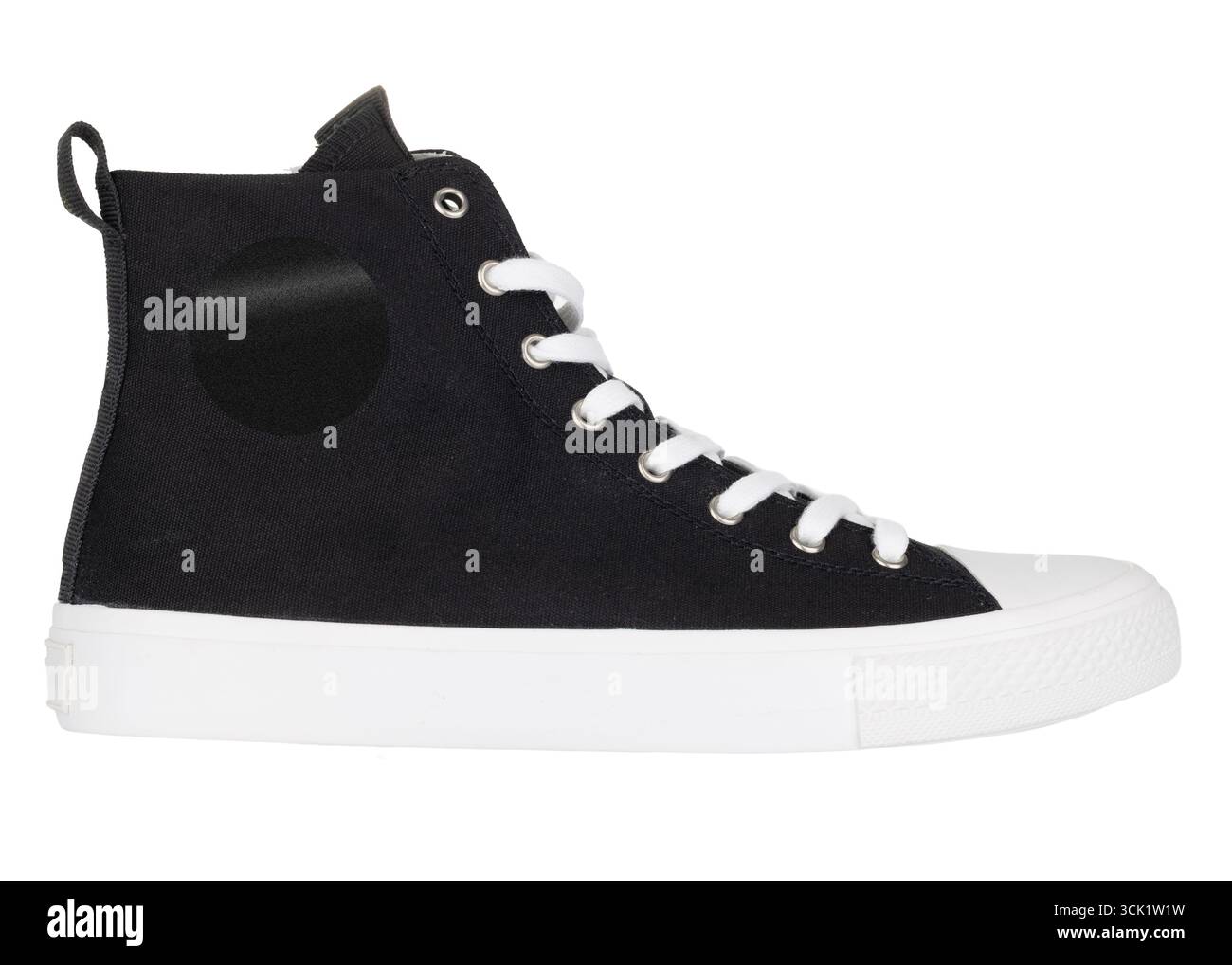 Black high top canvas sneaker with white sole Stock Photo
