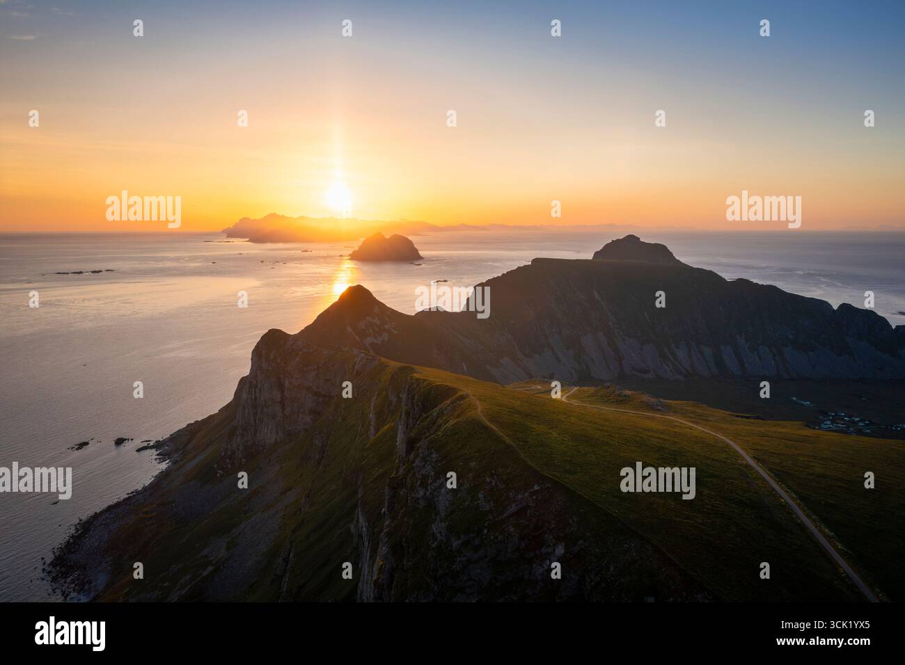 Aerial view of the rocky peaks and beaches of the island of Vaeroy. Sorland, Vaeroy, Nordland, Lofoten, Norway, Europe. Stock Photo
