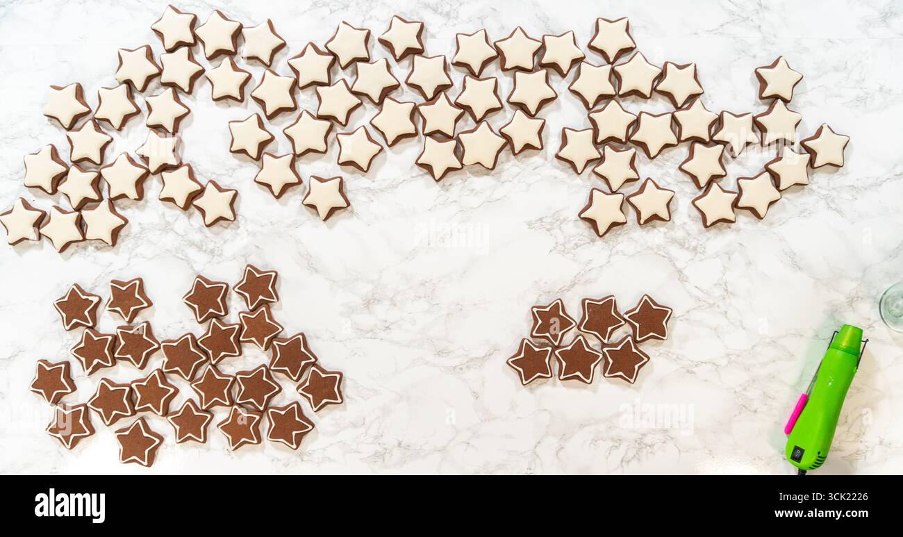 Perfectly Icing Star Cookies with Royal Icing Stock Photo - Alamy