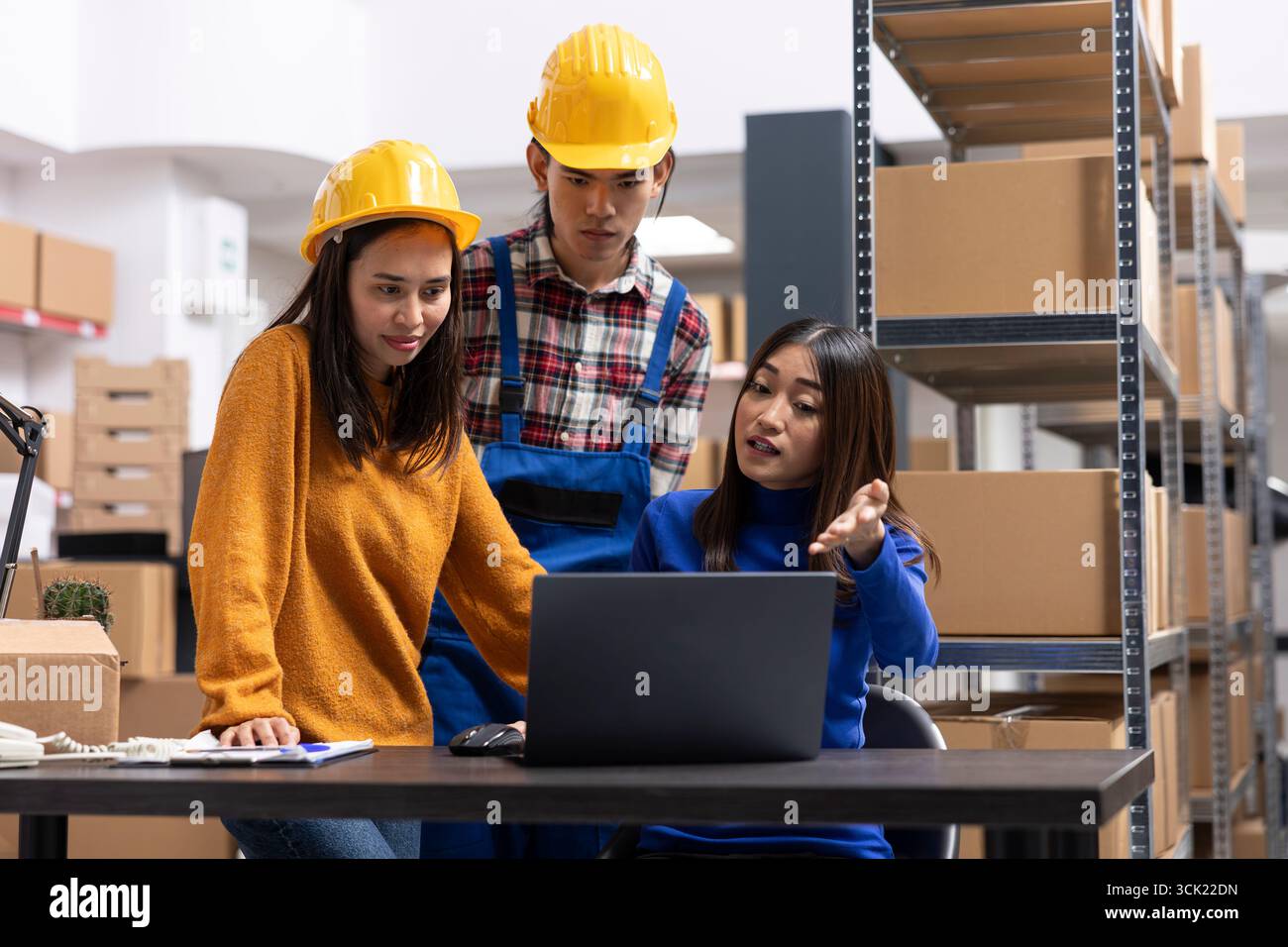Employees team organizing boxes hi-res stock photography and images - Alamy